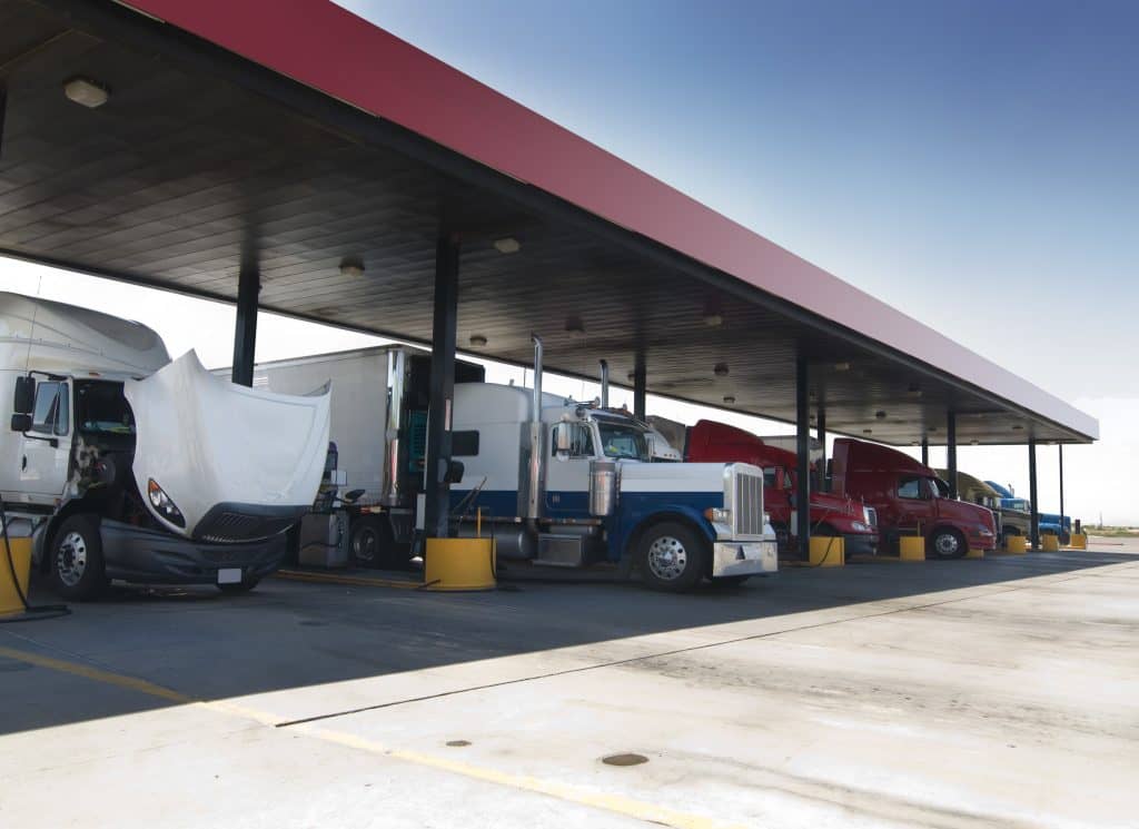 Trucks Fueling At Gas Station 1024x745